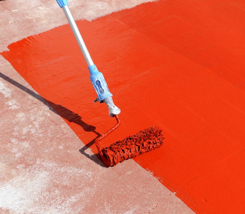 roof coatings brush and red coating